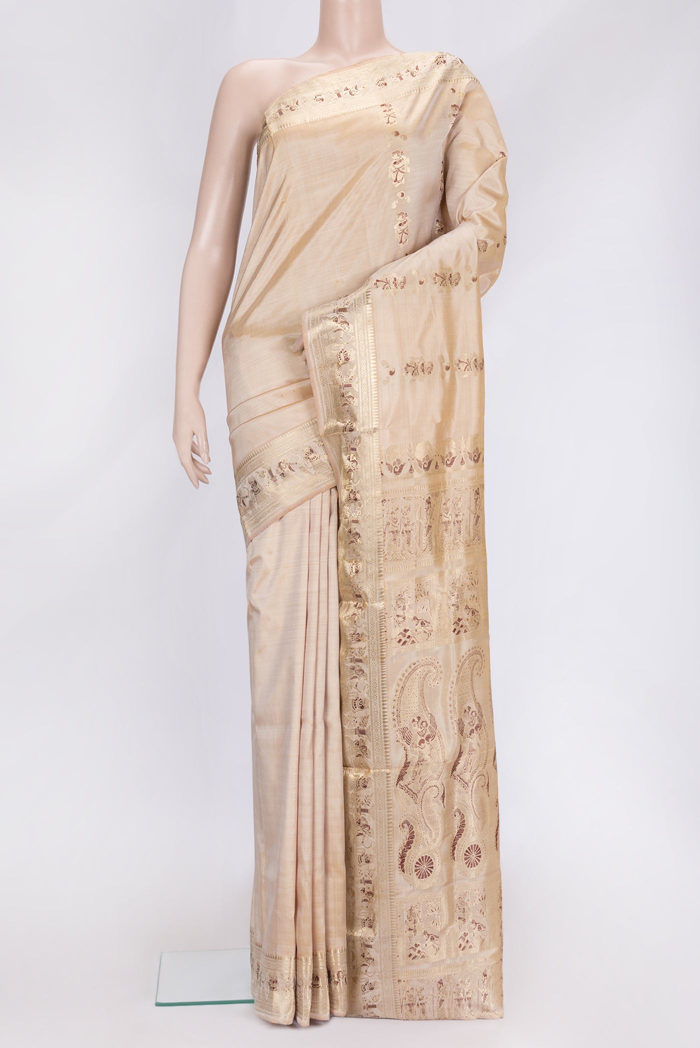 Beige Dual Tone Baluchari Silk Saree with Zari And Thread Butta on the body and Fancy Border.  displayed on a mannequin