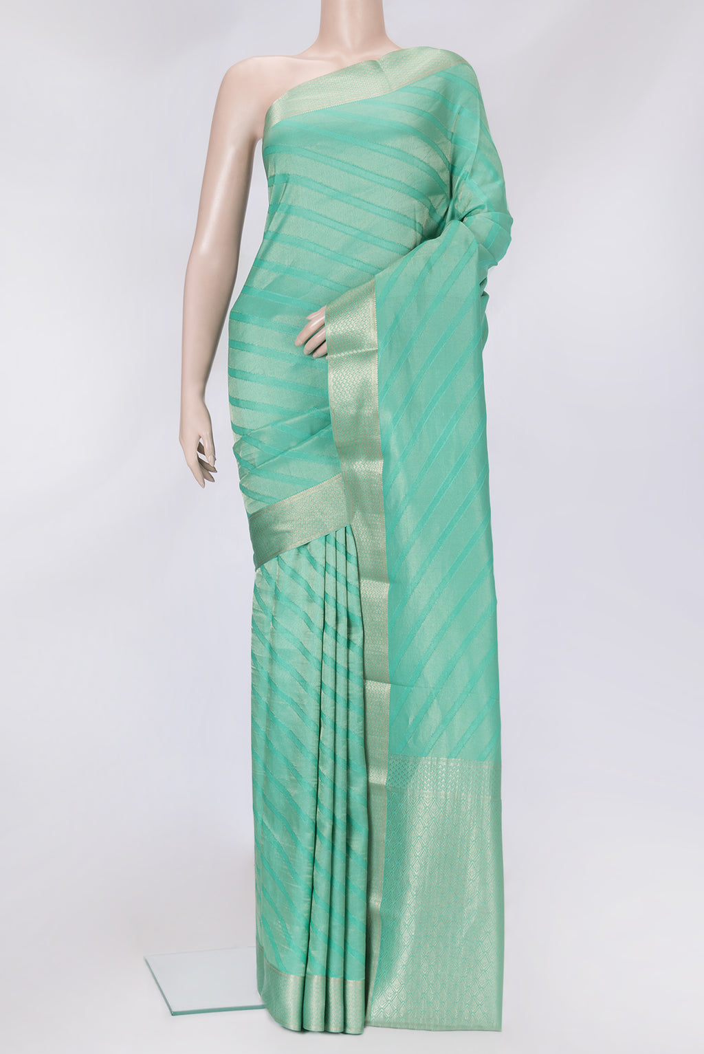 Sea Green Dual Tone Tussar Silk Saree with Zari Brocade on the body and Zari Border.  displayed on a mannequin