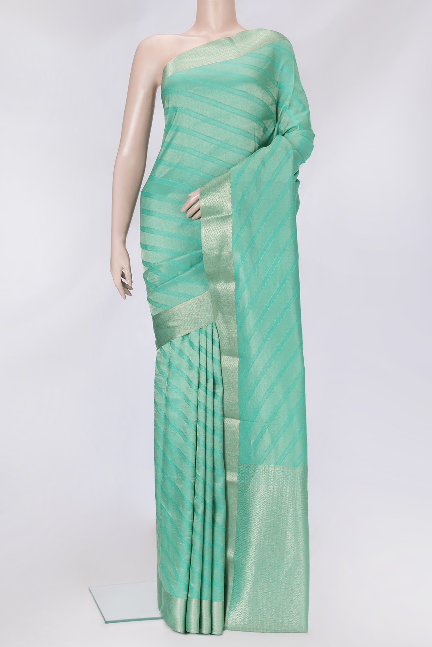 Sea Green Dual Tone Tussar Silk Saree with Zari Brocade on the body and Zari Border.  displayed on a mannequin