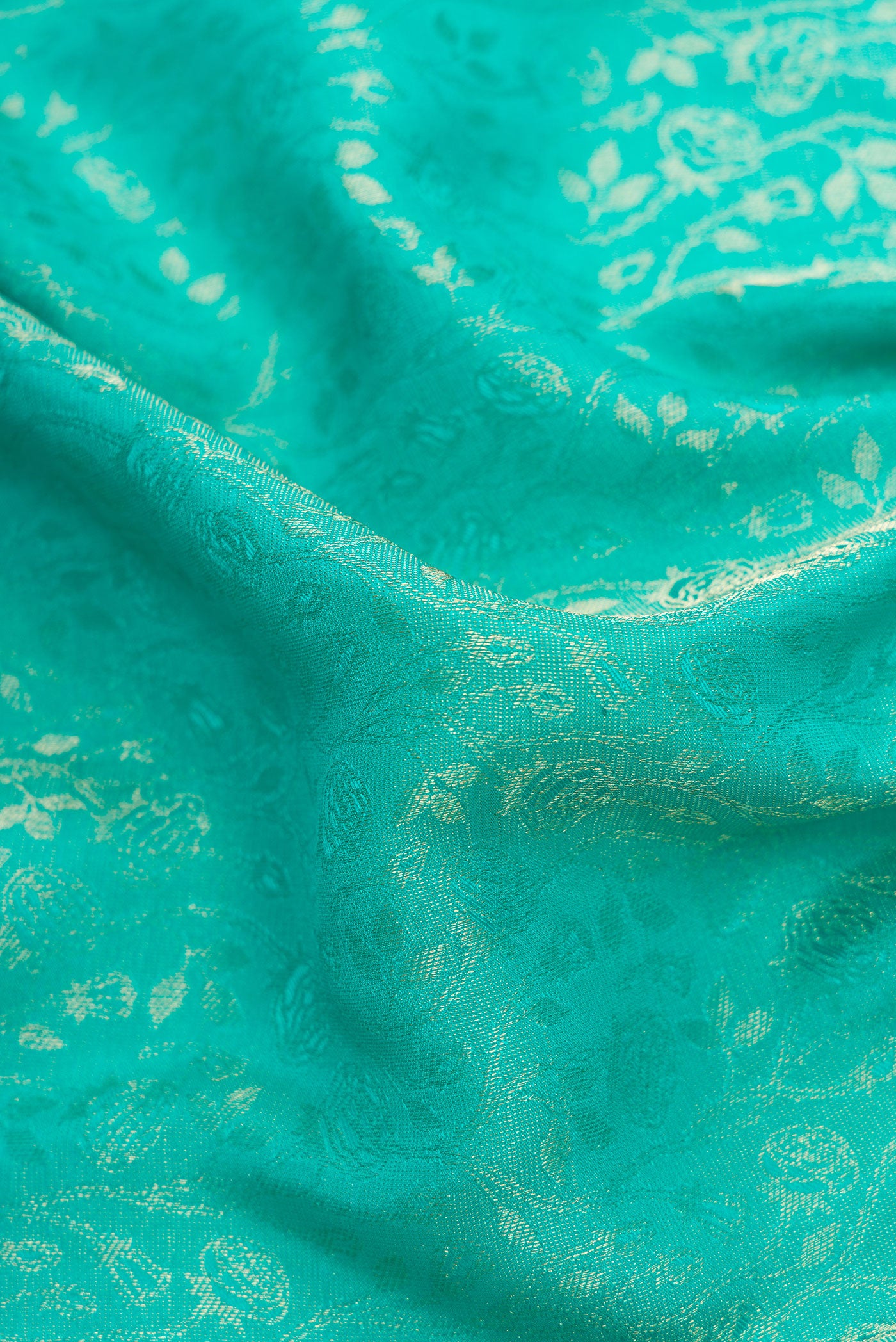 Close up of Sky Blue Dual Tone Mysore Silk Saree with Zari Brocade on the body and Zari Border.  displaying folds
