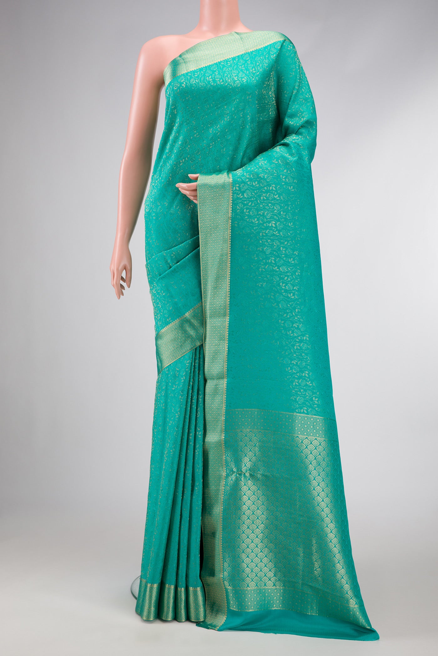 Sky Blue Dual Tone Mysore Silk Saree with Zari Brocade on the body and Zari Border.  displayed on a mannequin