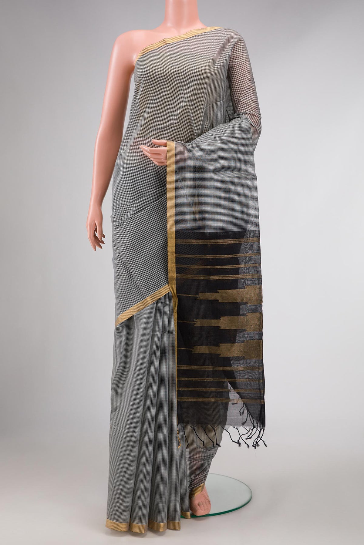 Grey Dual Tone Silk Cotton Saree with Checked design on the body and Zari Border displayed on a mannequin