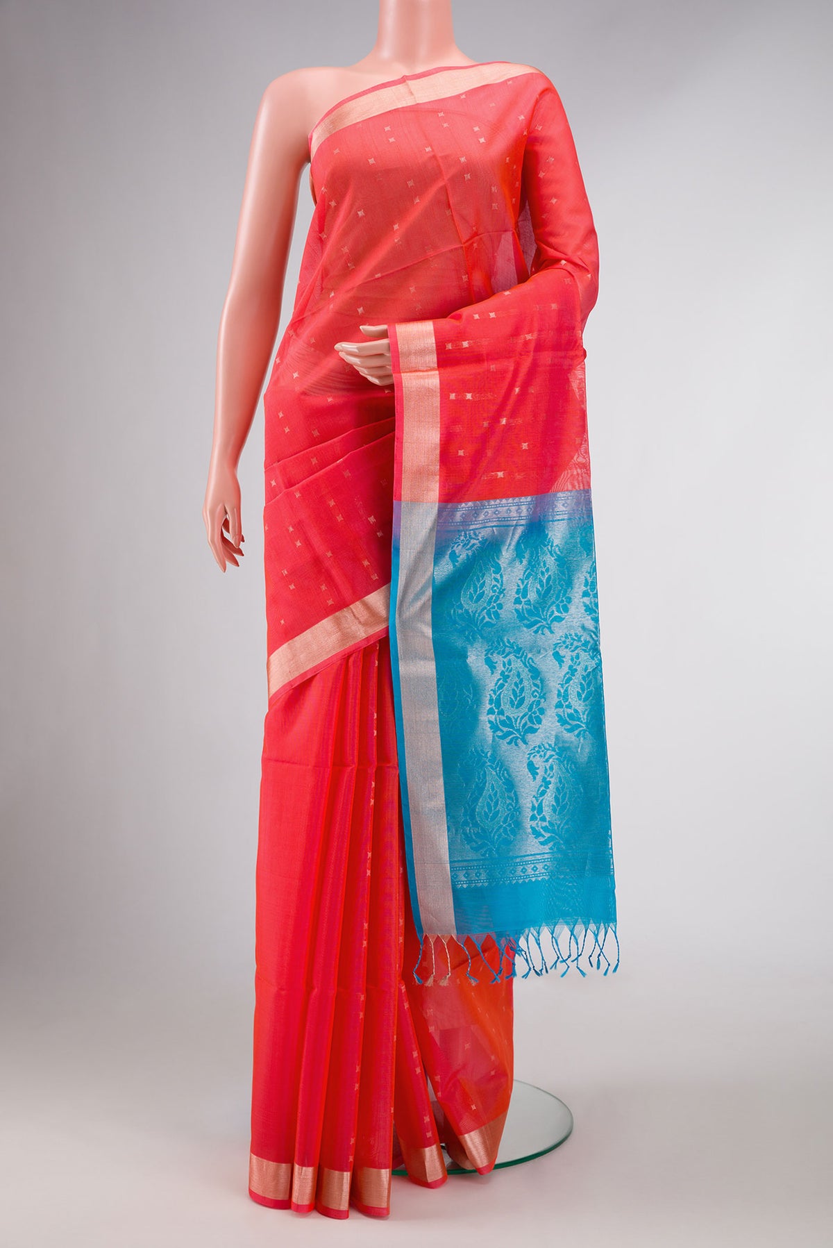 Orange Dual Tone Silk Cotton Saree with Zari Butta on the body and Zari Border displayed on a mannequin