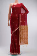 Maroon Silk Cotton Saree with Zari Butta on the body and Zari Border displayed on a mannequin