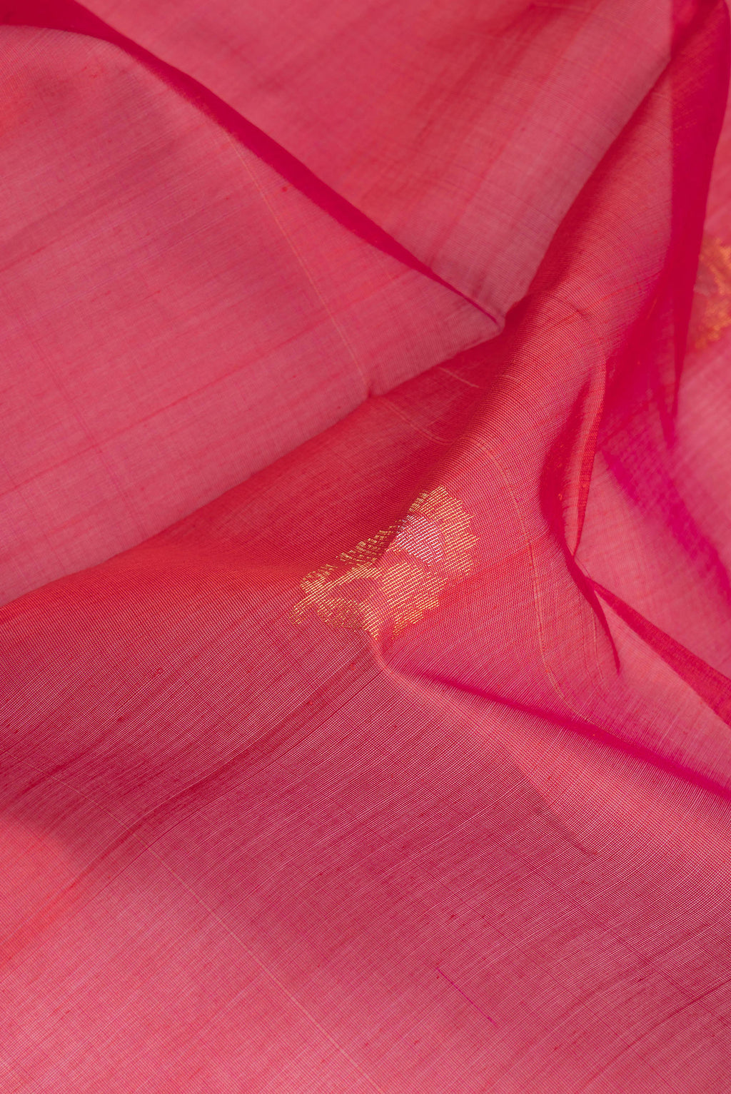 Close up of Pink Dual Tone Silk Cotton Saree with Zari Butta on the body and Zari Border.  displaying folds