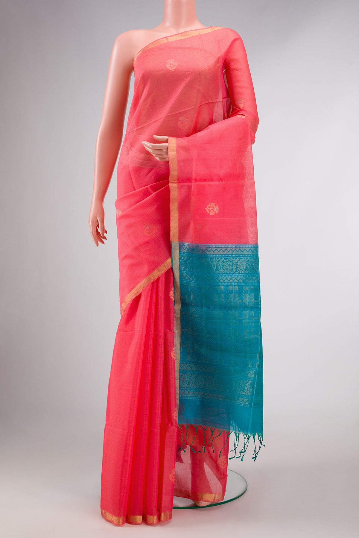 Golden Peach Dual Tone Silk Cotton Saree with Zari Butta on the body and Zari Border displayed on a mannequin