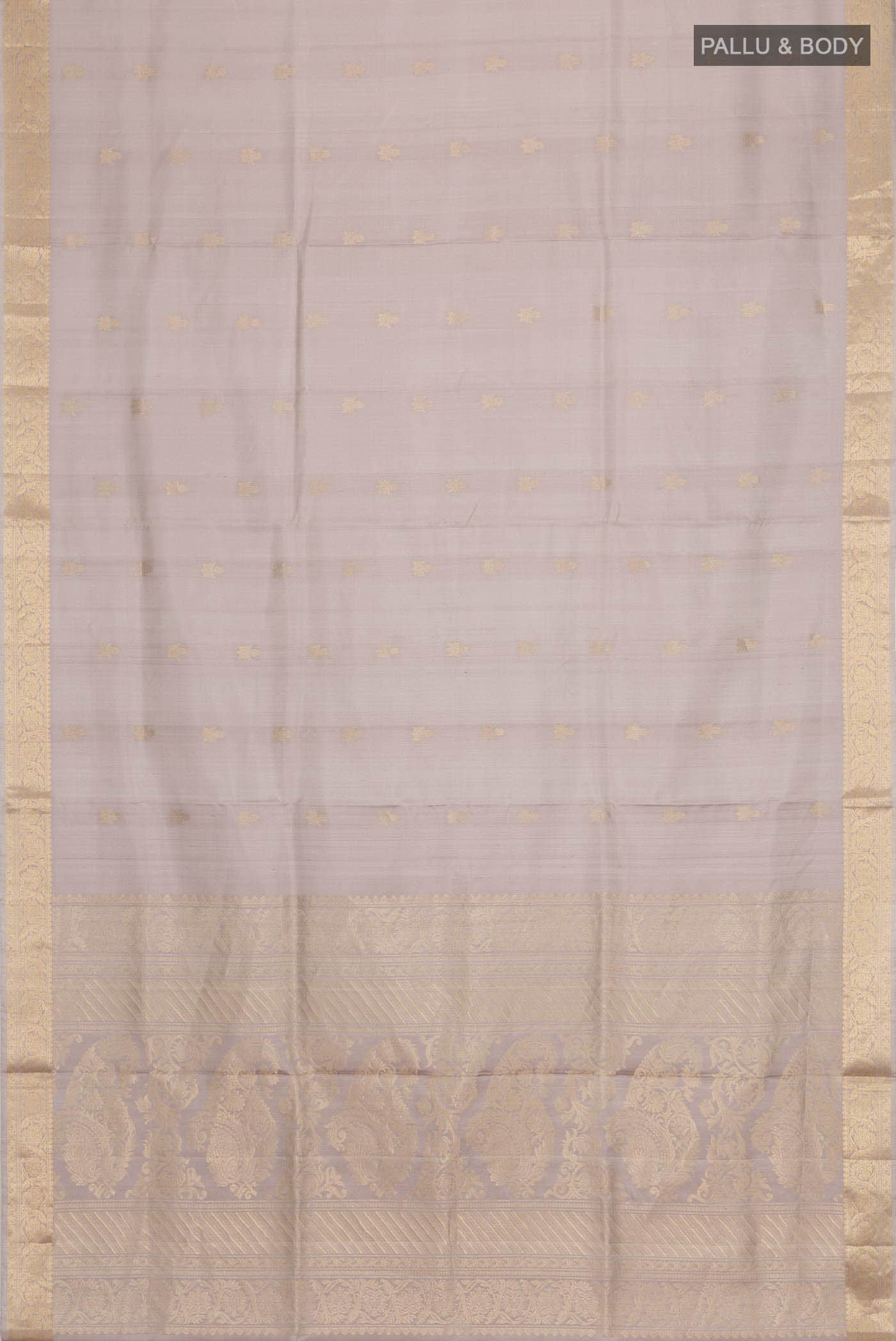 Flat view of Grey Soft Silk Saree with Zari Butta on the body and Zari Border