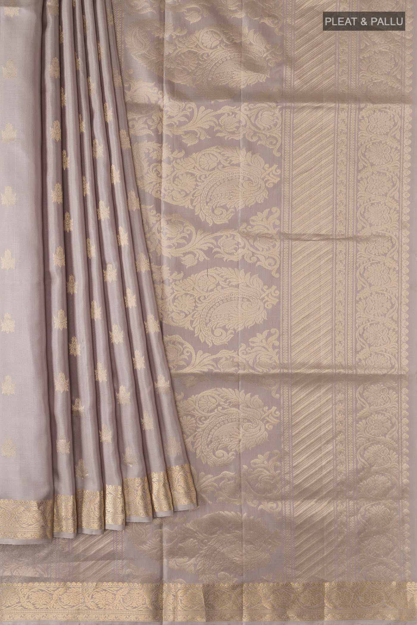 Pleats and pallu of Grey Soft Silk Saree with Zari Butta on the body and Zari Border