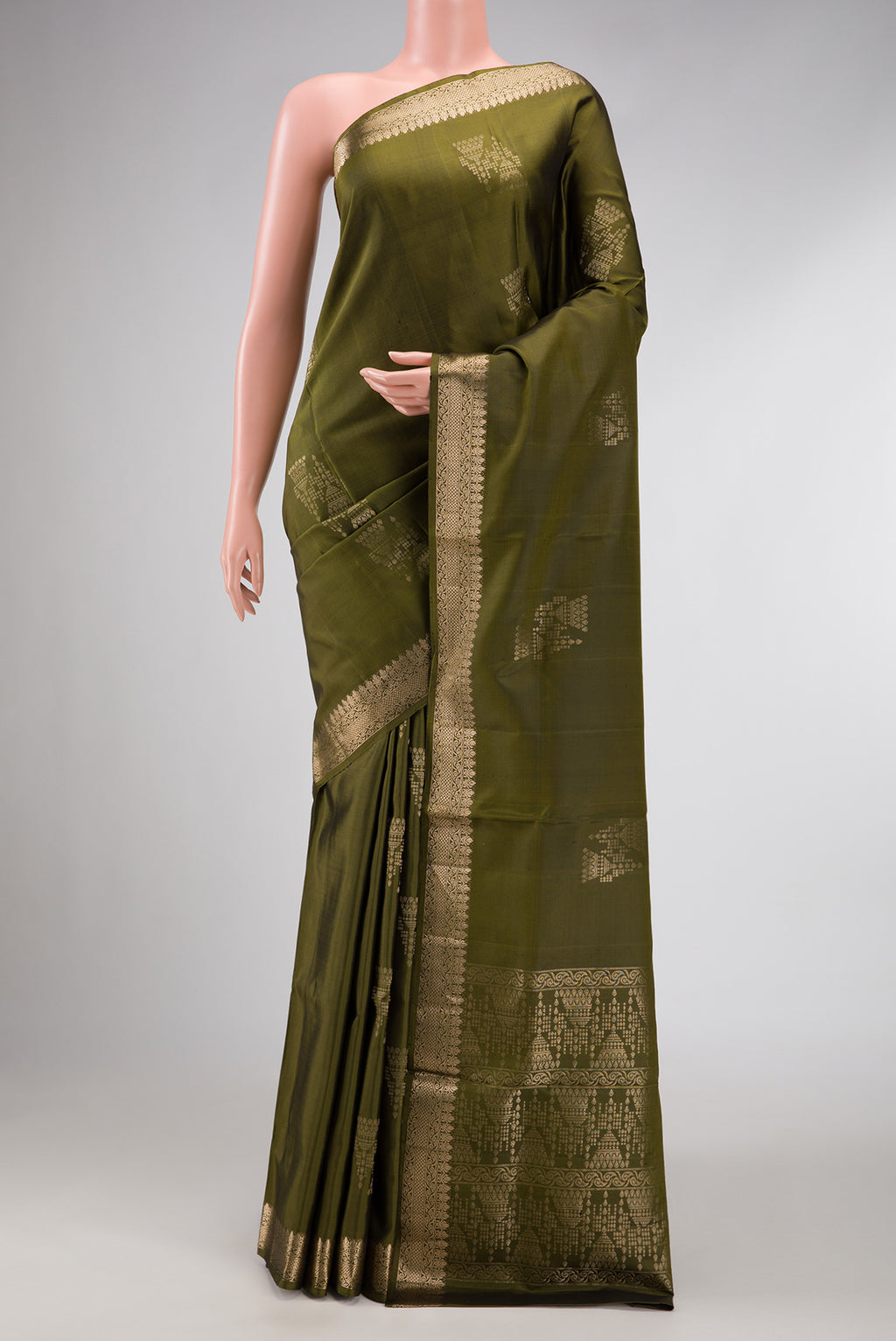 Mehandi Green Dual Tone Soft Silk Saree with Zari Butta on the body and Zari Border.  displayed on a mannequin