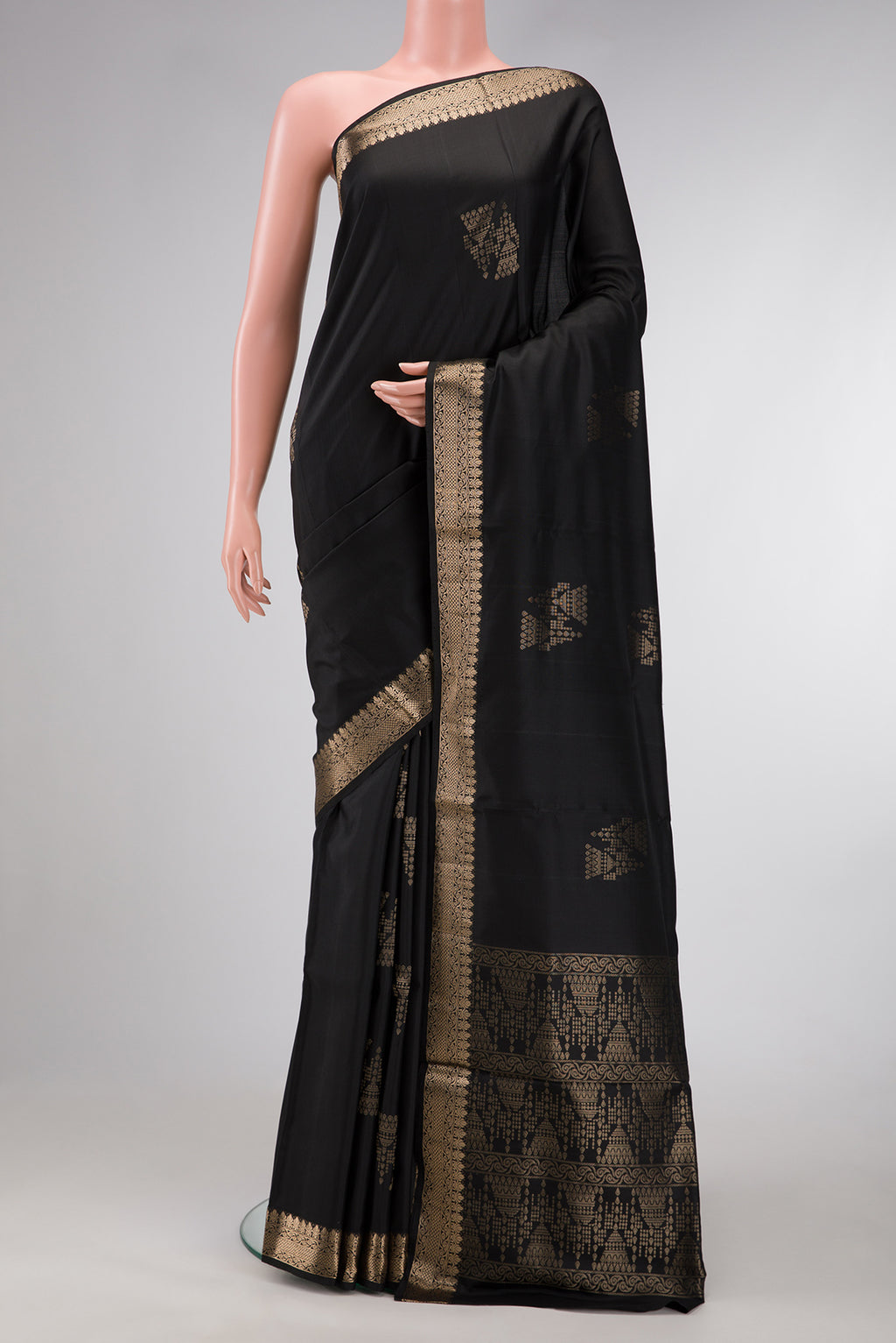 Black Dual Tone Soft Silk Saree with Zari Butta on the body and Zari Border.  displayed on a mannequin