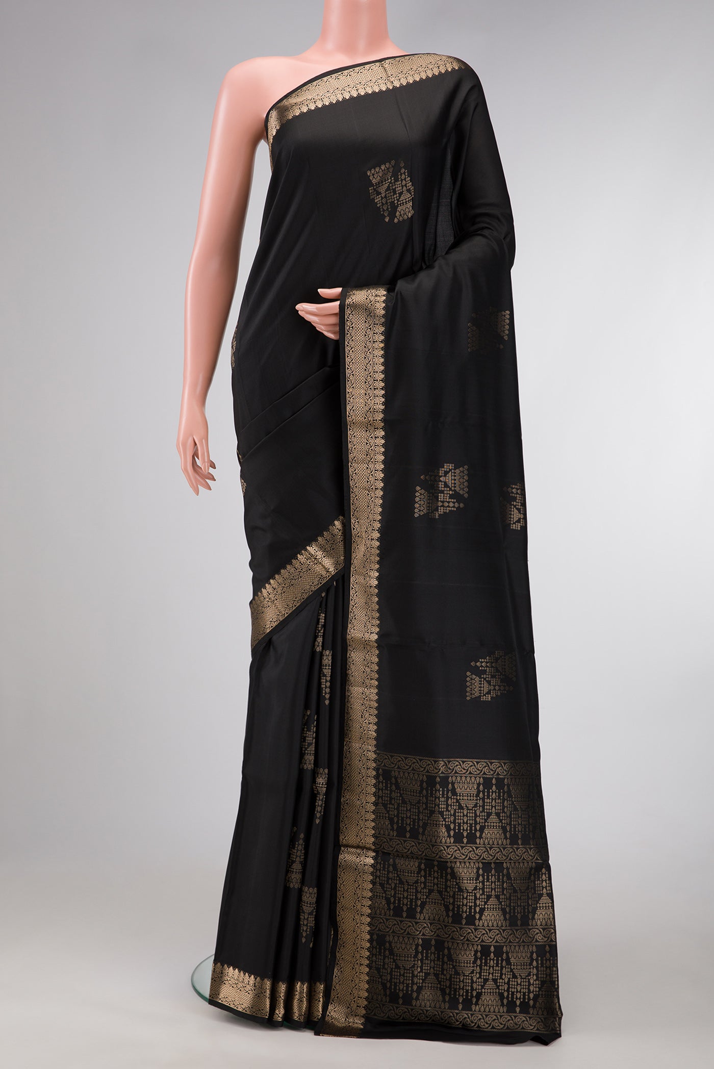 Black Dual Tone Soft Silk Saree with Zari Butta on the body and Zari Border.  displayed on a mannequin