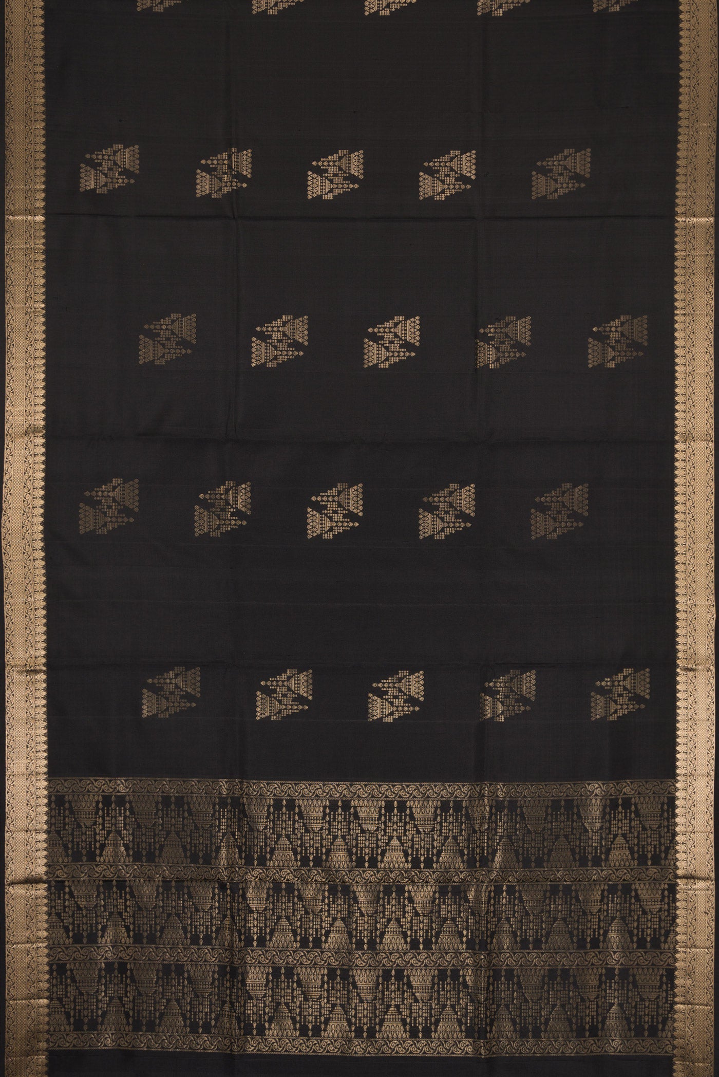 Flat view of Black Dual Tone Soft Silk Saree with Zari Butta on the body and Zari Border. 