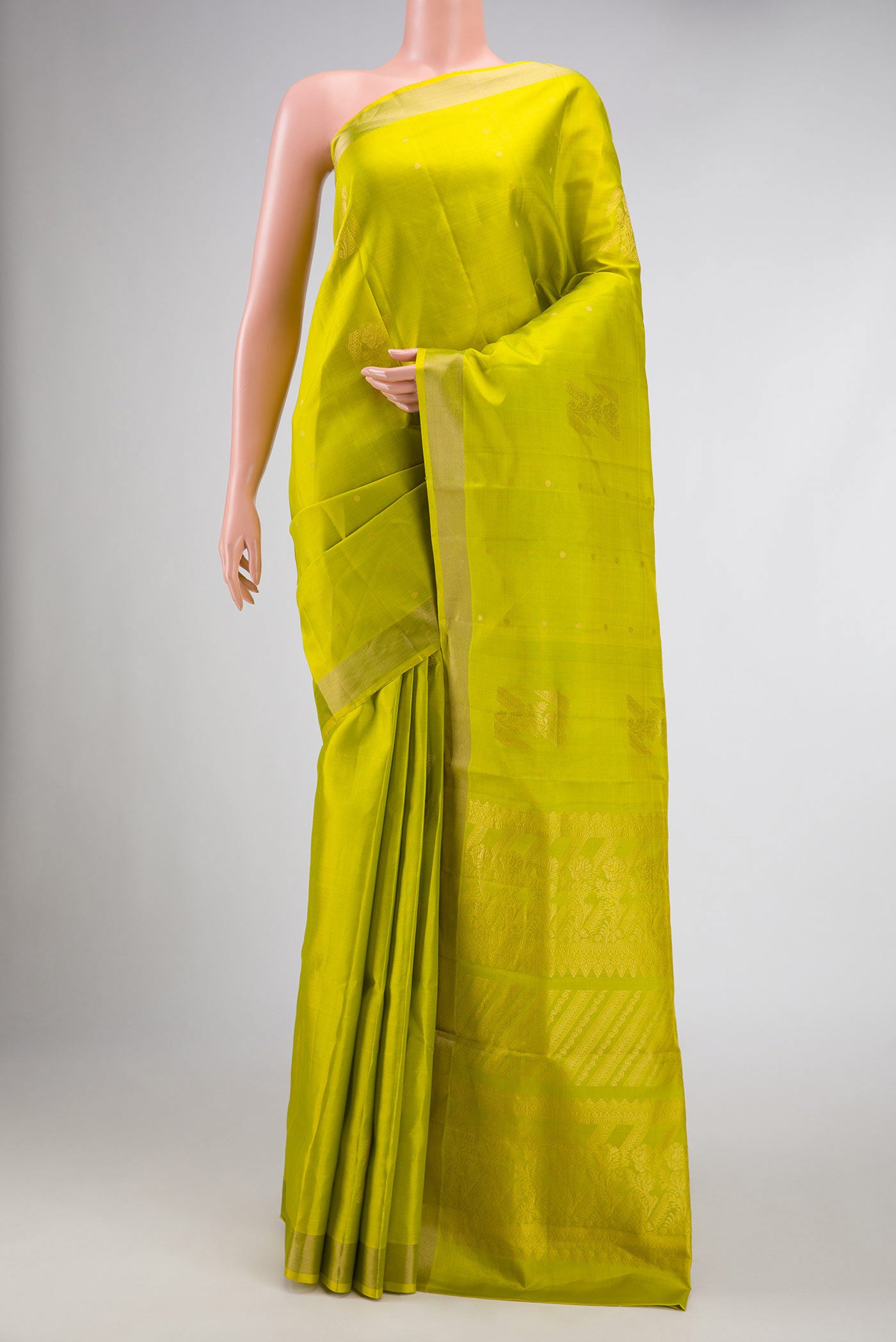 Parrot Green Dual Tone Soft Silk Saree with Zari Butta on the body and Zari Border displayed on a mannequin