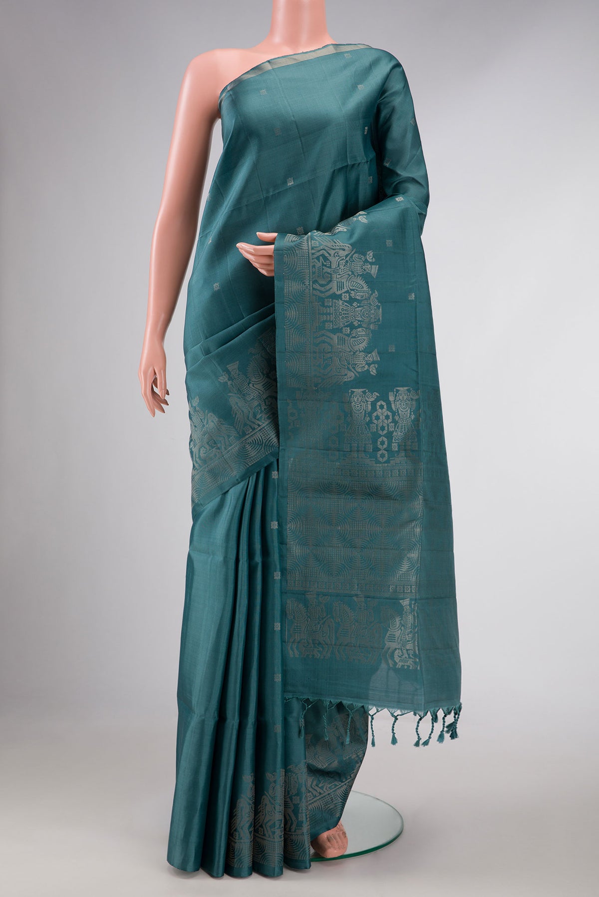 Maya Blue Dual Tone Soft Silk Saree with Zari Butta on the body and Without Border displayed on a mannequin
