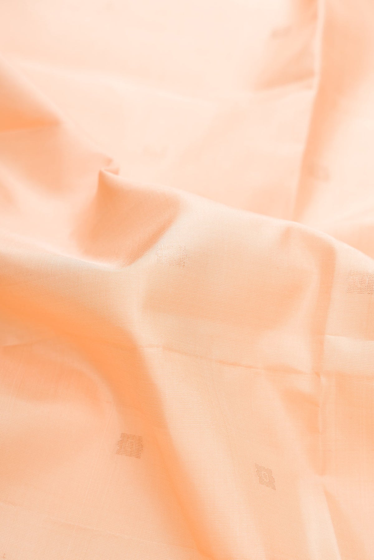Close up of Sandal Dual Tone Soft Silk Saree with Zari Butta on the body and Fancy Border displaying folds