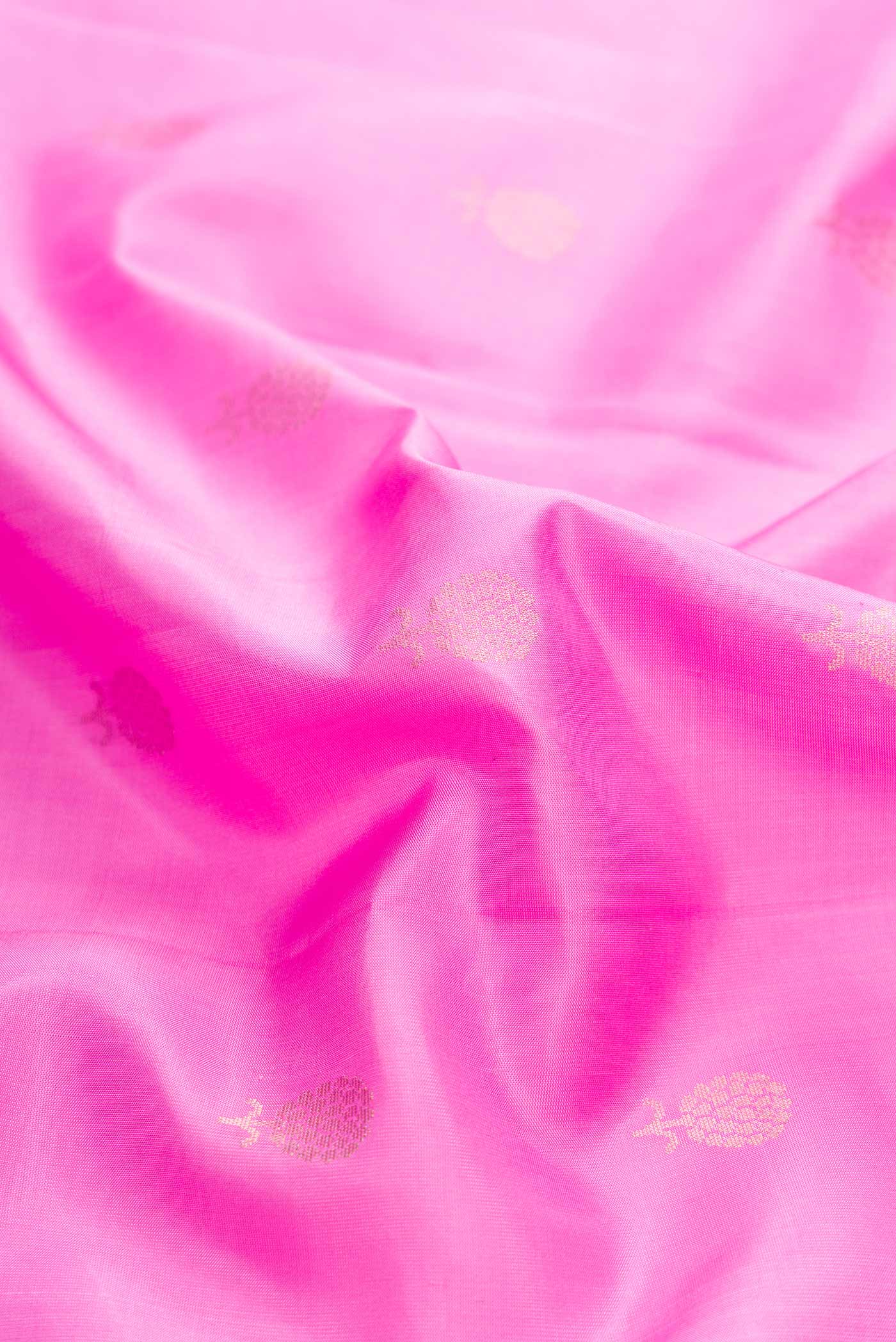 Close up of Rose pink Soft Silk Saree with Zari Butta on the body and Zari Border displaying folds