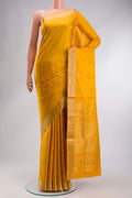 Yellow Soft Silk Saree with Zari Butta on the body and Zari Border displayed on a mannequin