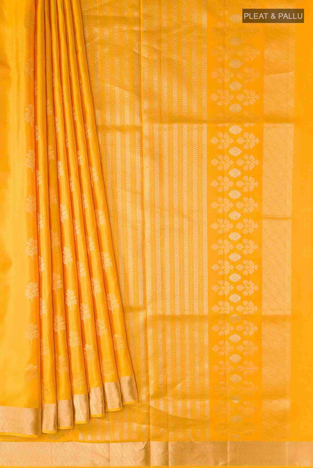Pleats and pallu of Yellow Soft Silk Saree with Zari Butta on the body and Zari Border