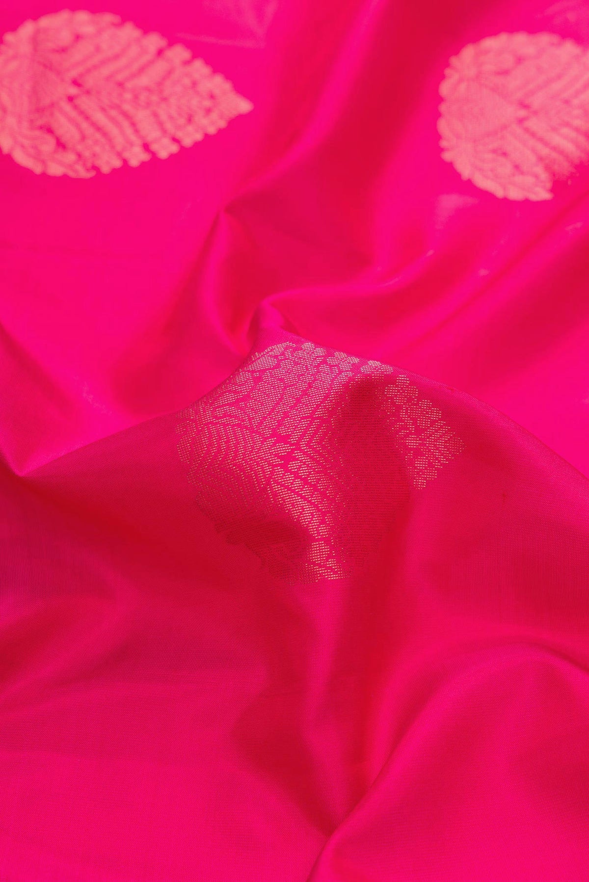 Close up of Dark Pink Dual Tone Soft Silk Saree with Zari Butta on the body and Zari Border displaying folds