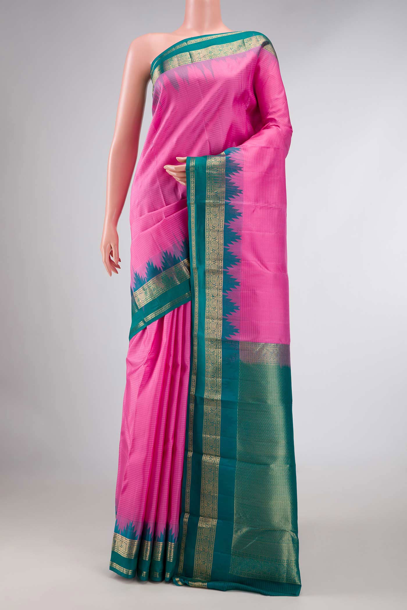 Pink Dual Tone Kanchipuram Silk Saree with Stripes on the body and Zari Border displayed on a mannequin