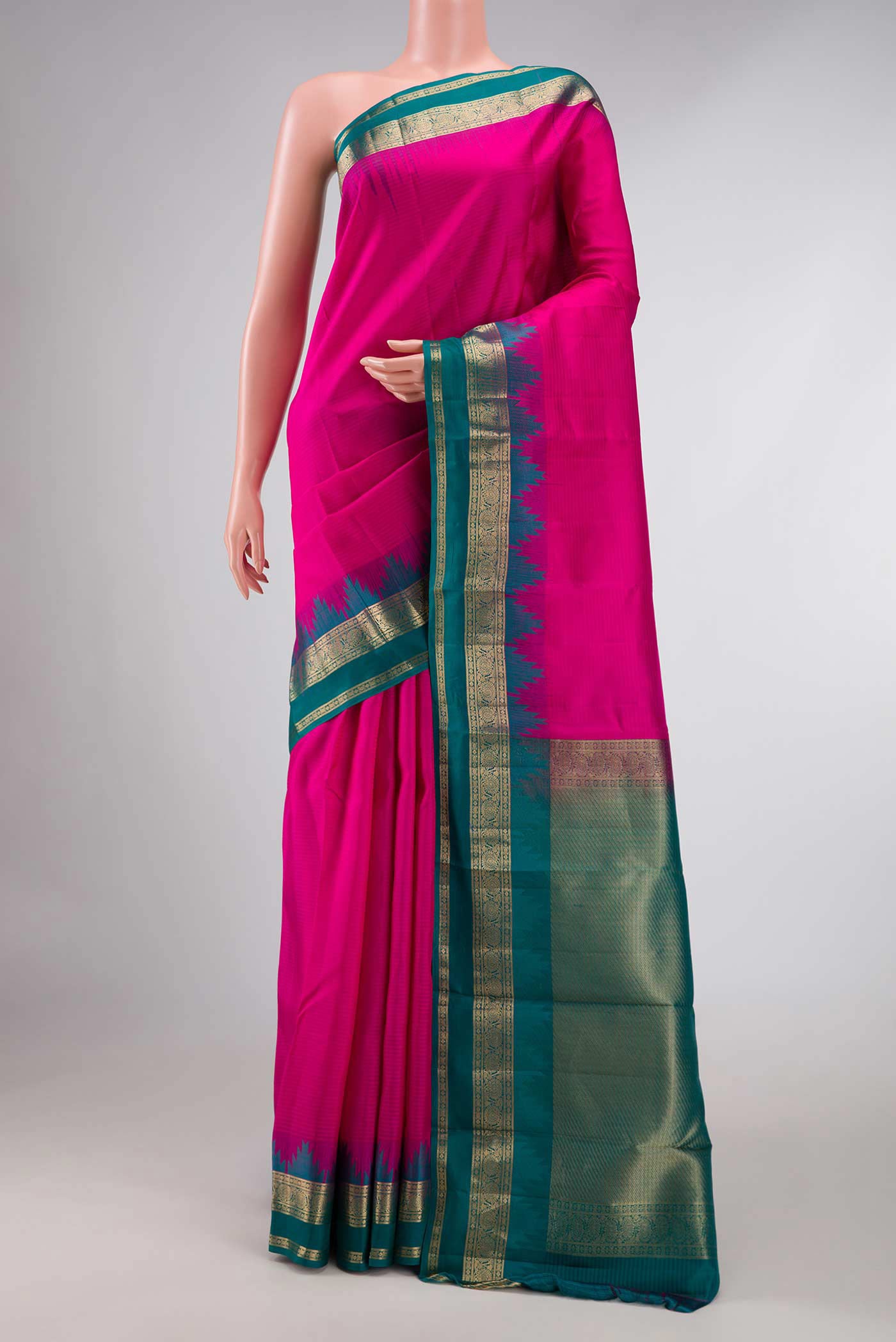 Pink Dual Tone Kanchipuram Silk Saree with Stripes on the body and Zari Border displayed on a mannequin