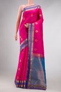 Pink Dual Tone Kanchipuram Silk Saree with Zari Butta on the body and Zari Border displayed on a mannequin