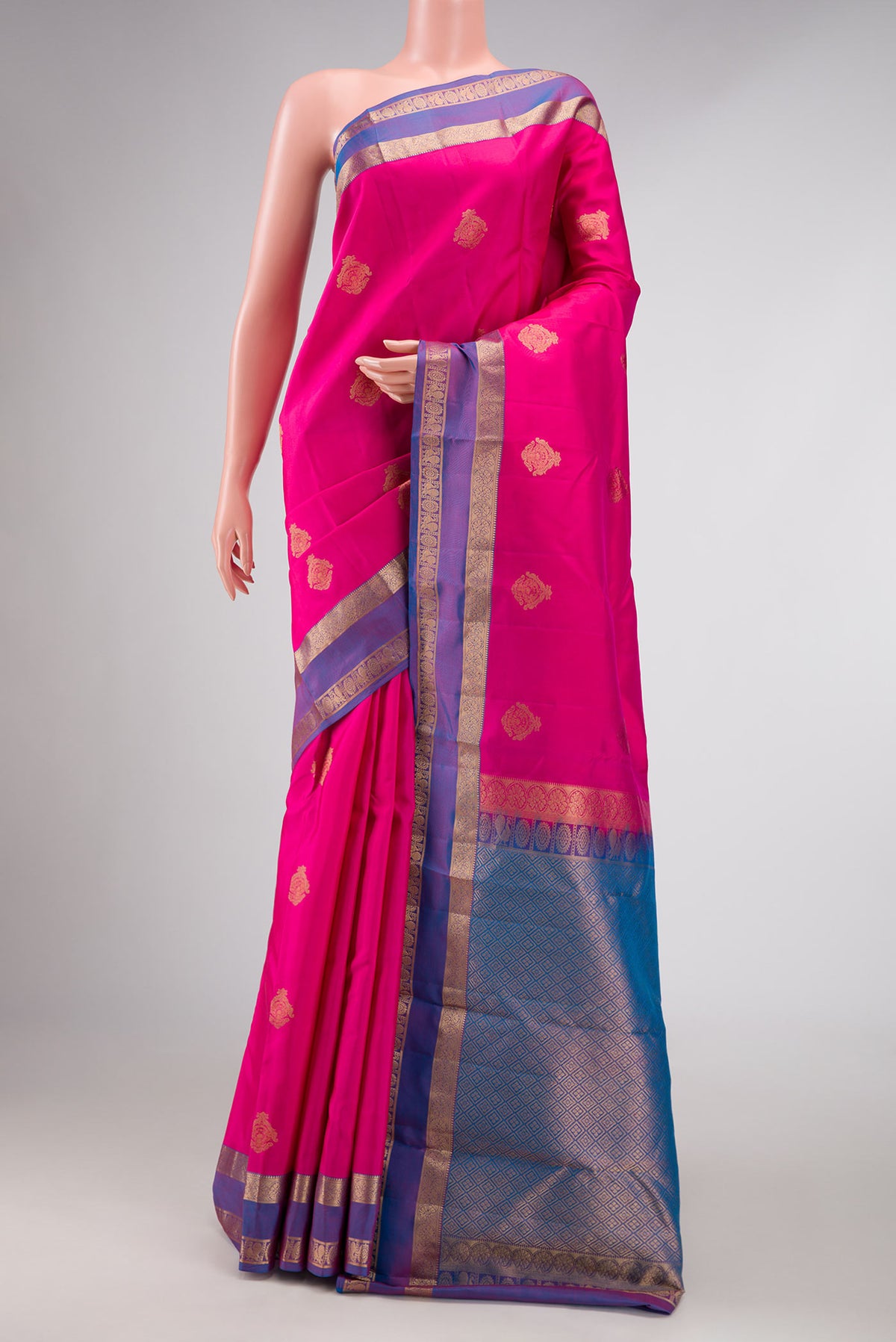 Pink Dual Tone Kanchipuram Silk Saree with Zari Butta on the body and Zari Border displayed on a mannequin