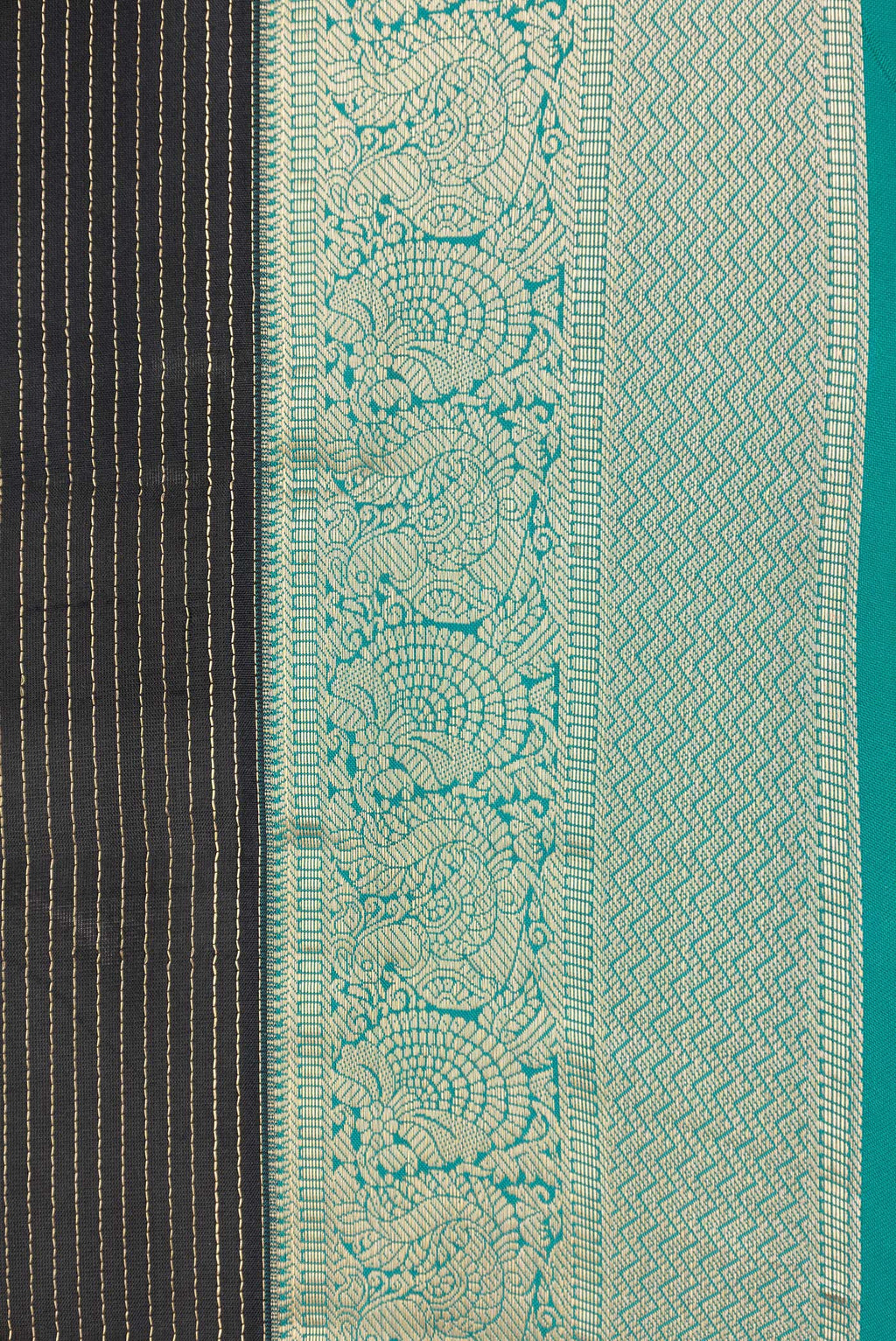 Border image of Black Dual Tone Kanchipuram Silk Saree with Stripes on the body and Zari Border. 