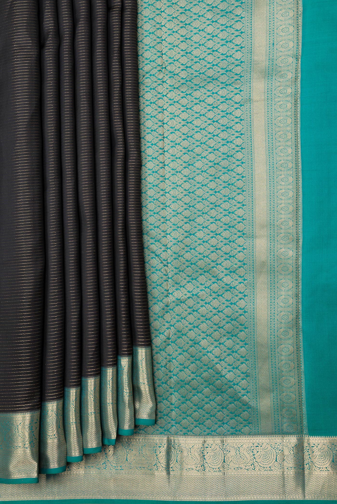 Pleats and pallu of Black Dual Tone Kanchipuram Silk Saree with Stripes on the body and Zari Border. 