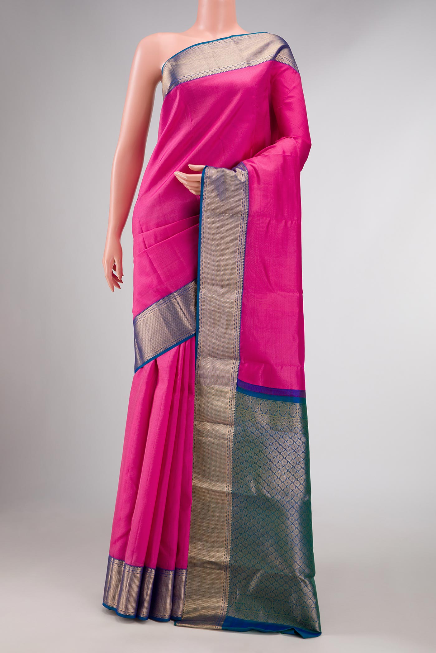 Pink Dual Tone Kanchipuram Silk Saree with Plain Body and Zari Border displayed on a mannequin