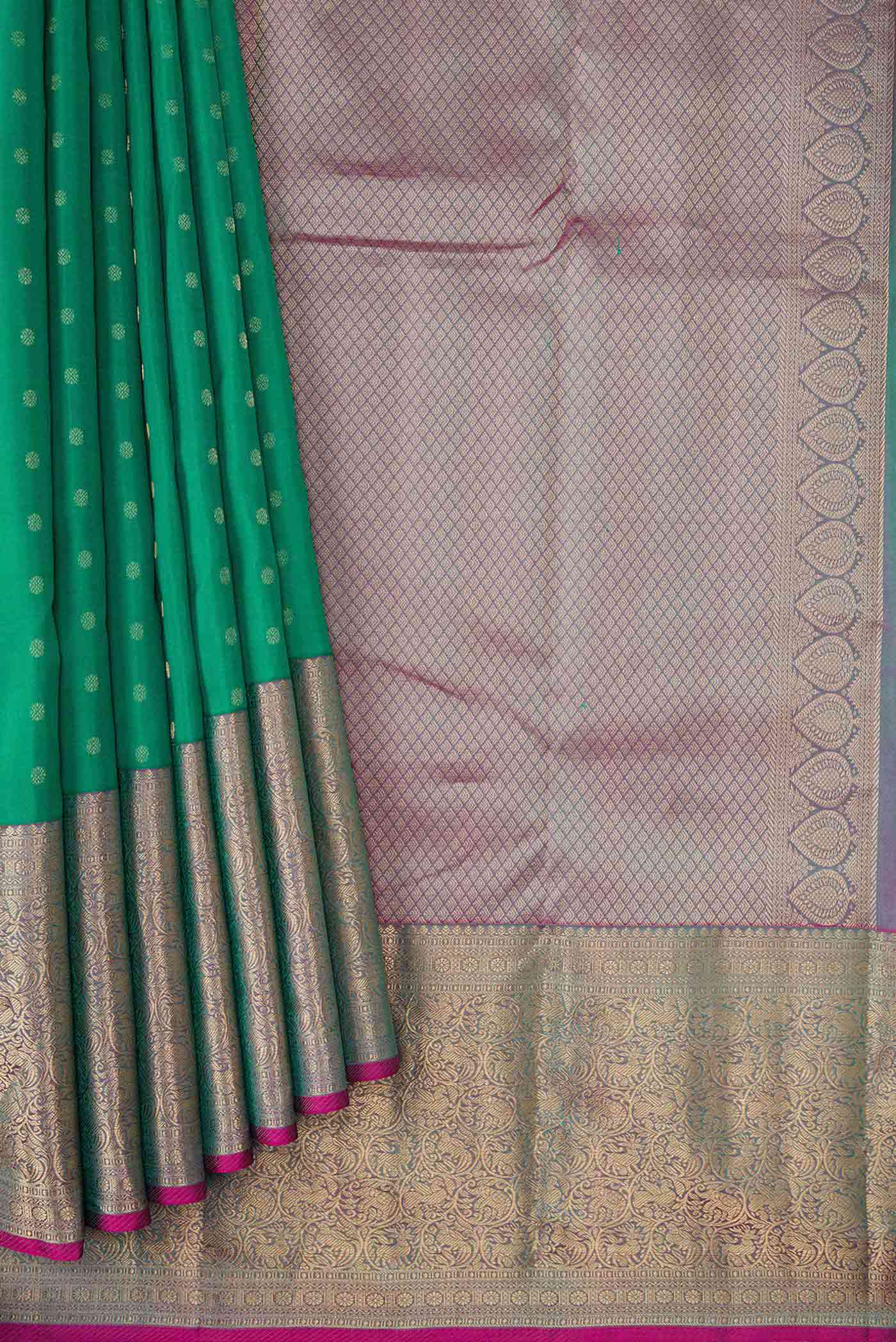 Pleats and pallu of Green Dual Tone Kanchipuram Silk Saree with Zari Butta on the body and Zari Border
