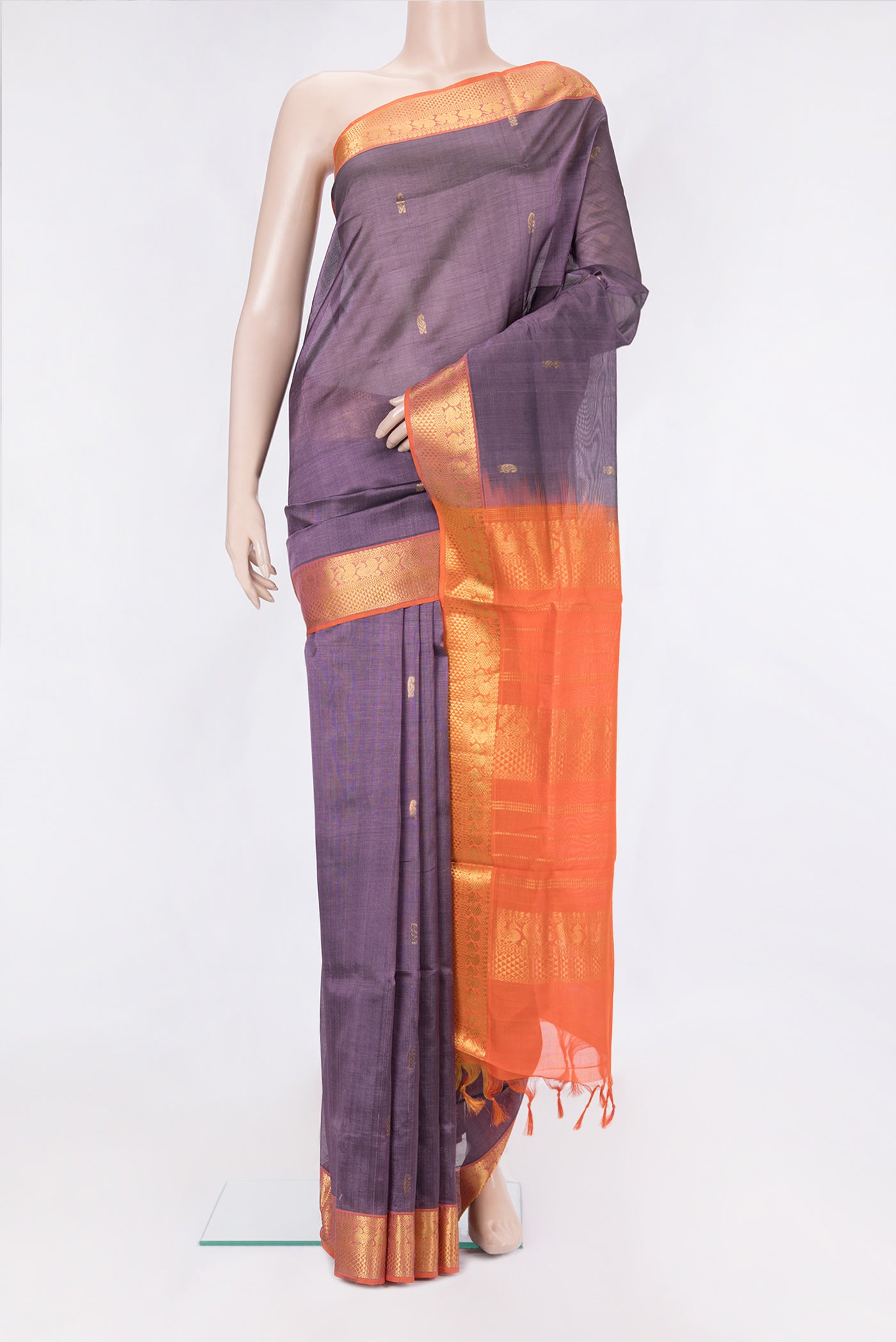 Purple Silk Cotton Saree with Zari Butta on the body and Zari Border.  displayed on a mannequin