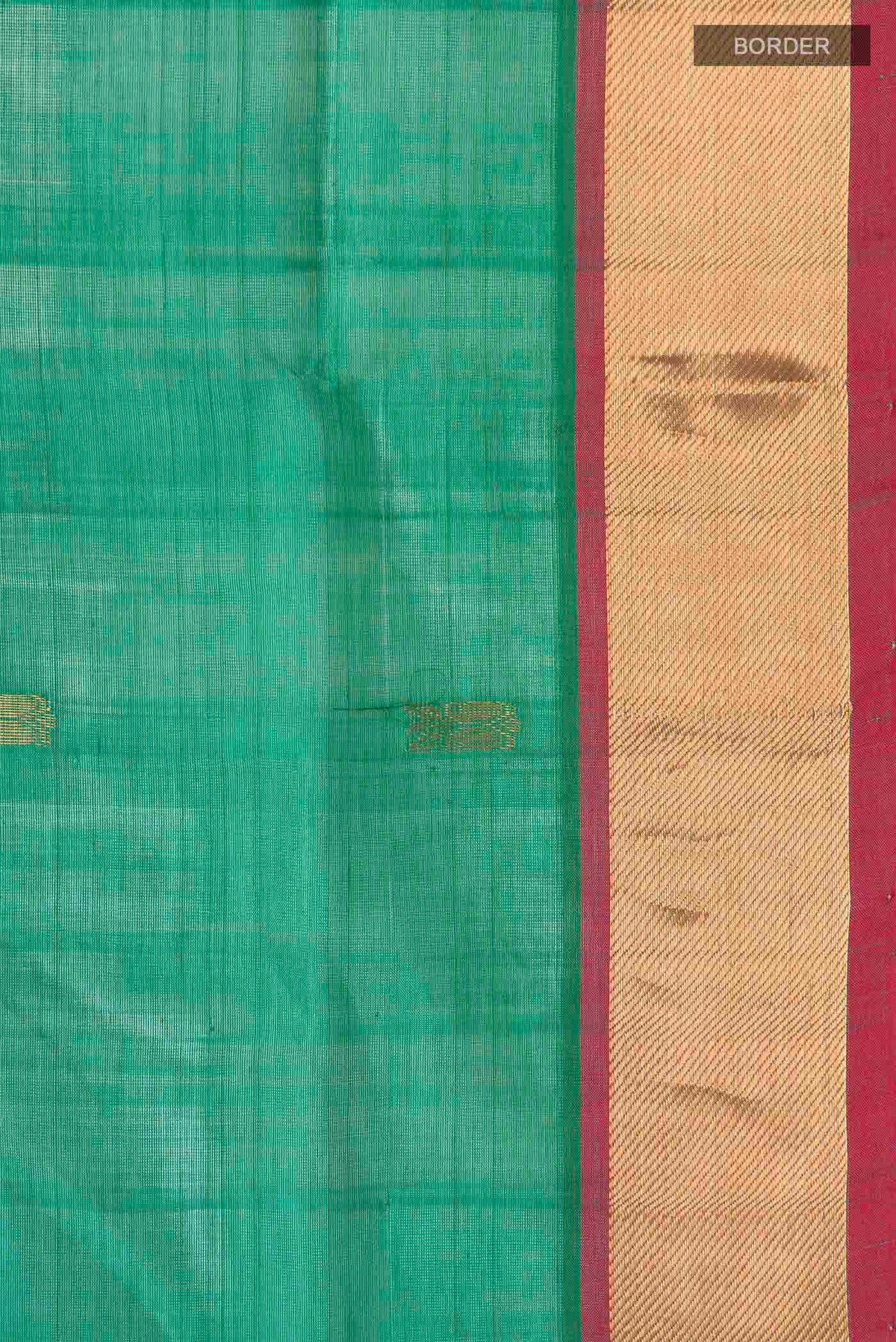 Border image of Green Silk Cotton Saree with Zari Butta on the body and Zari Border
