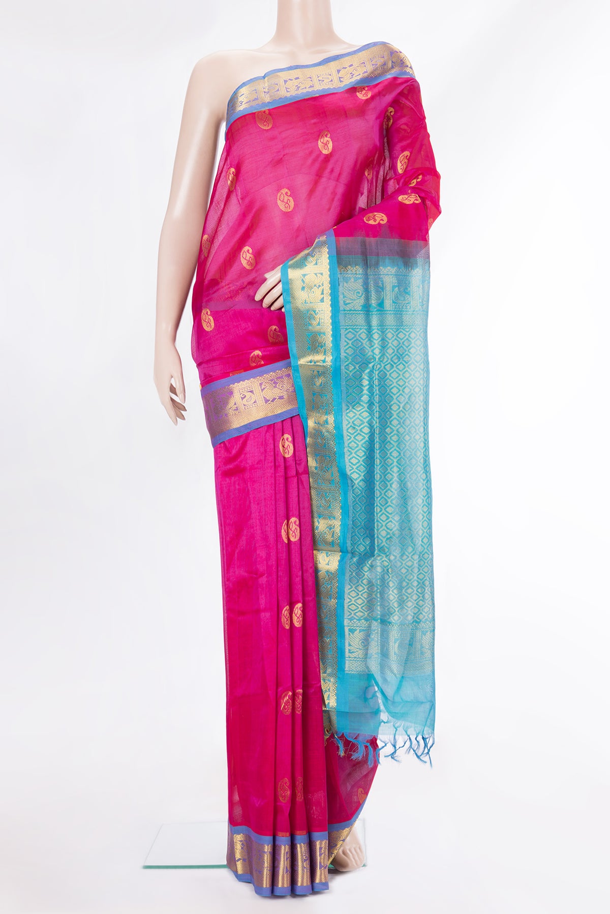 Pink Silk Cotton Saree with Zari Butta on the body and Zari Border.  displayed on a mannequin