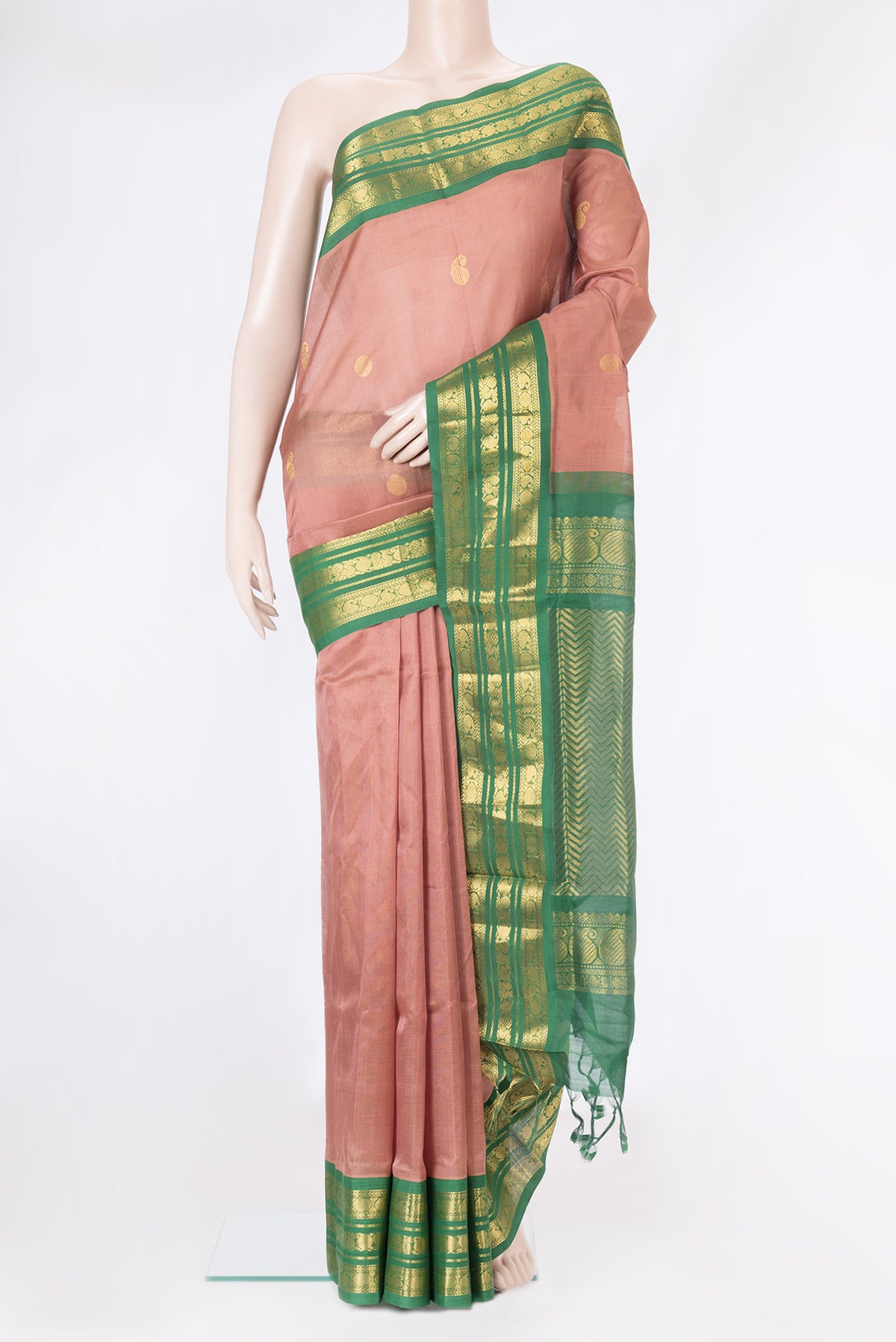 Rose Gold Silk Cotton Saree with Zari Butta on the body and Zari Border.  displayed on a mannequin