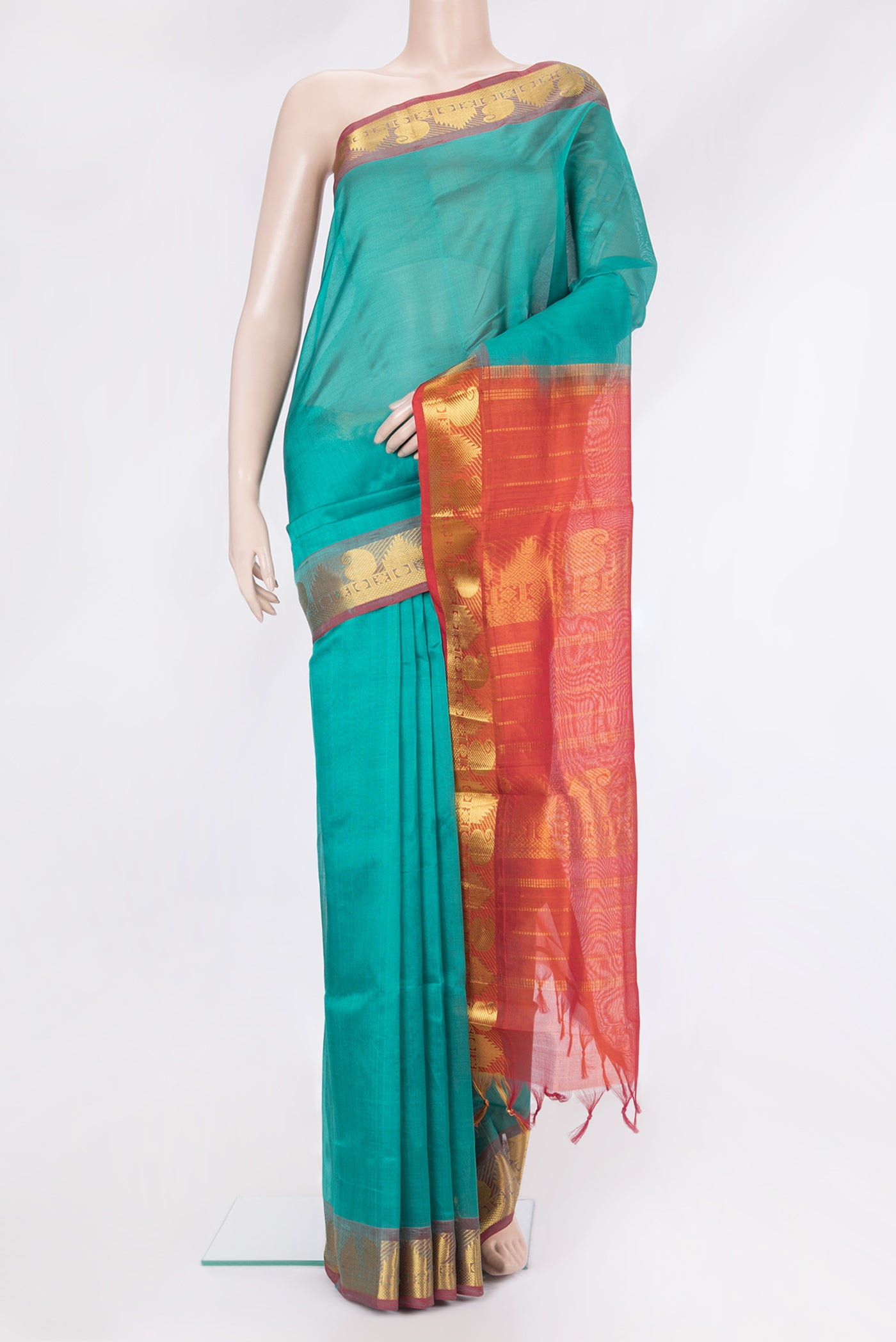 Sea Green Silk Cotton Saree with Plain Body and Zari Border.  displayed on a mannequin