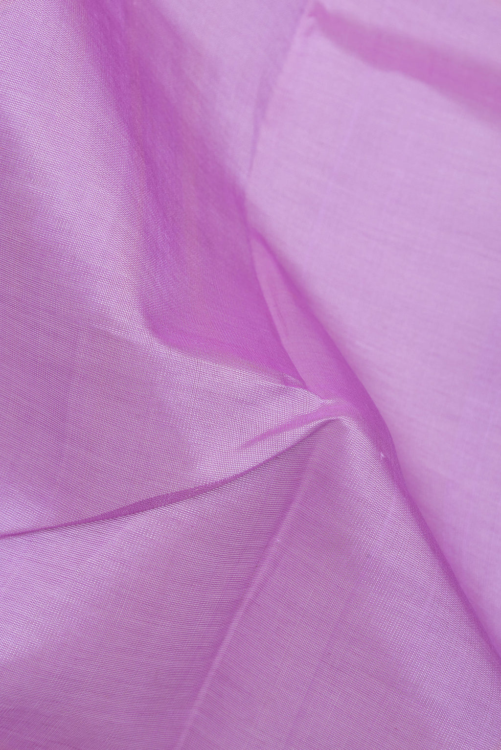 Close up of Lavender Silk Cotton Saree with Plain Body and Zari Border.  displaying folds