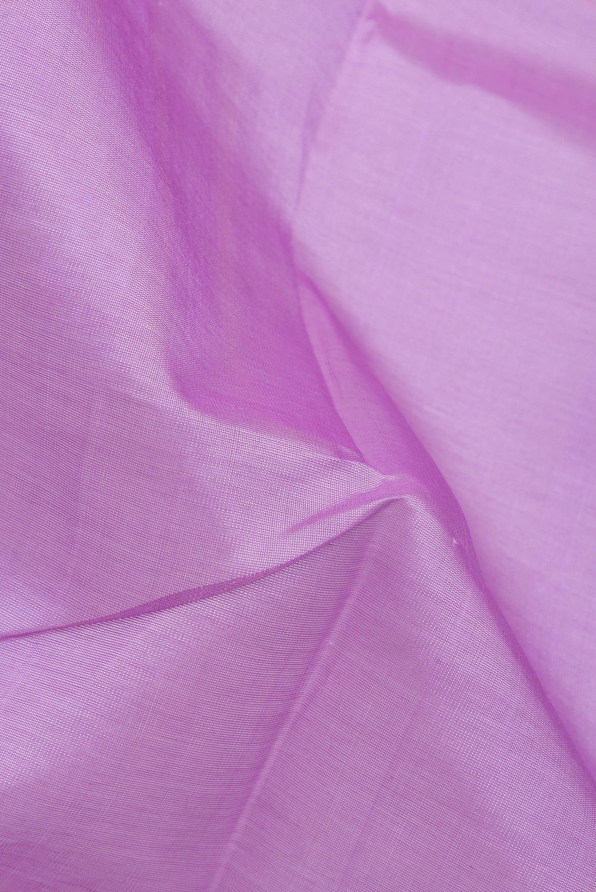 Close up of Lavender Silk Cotton Saree with Plain Body and Zari Border.  displaying folds