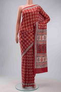 Rust Printed Silk Saree with Printed design on the body and Printed Border displayed on a mannequin