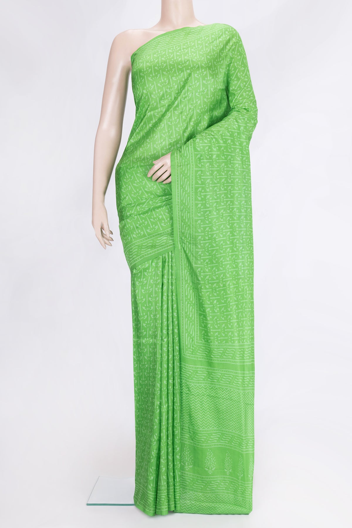 Green Dual Tone Printed Silk Saree with Printed design on the body and Printed Border.  displayed on a mannequin