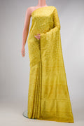 Yellow Printed Silk Saree with Printed design on the body and Printed Border.  displayed on a mannequin