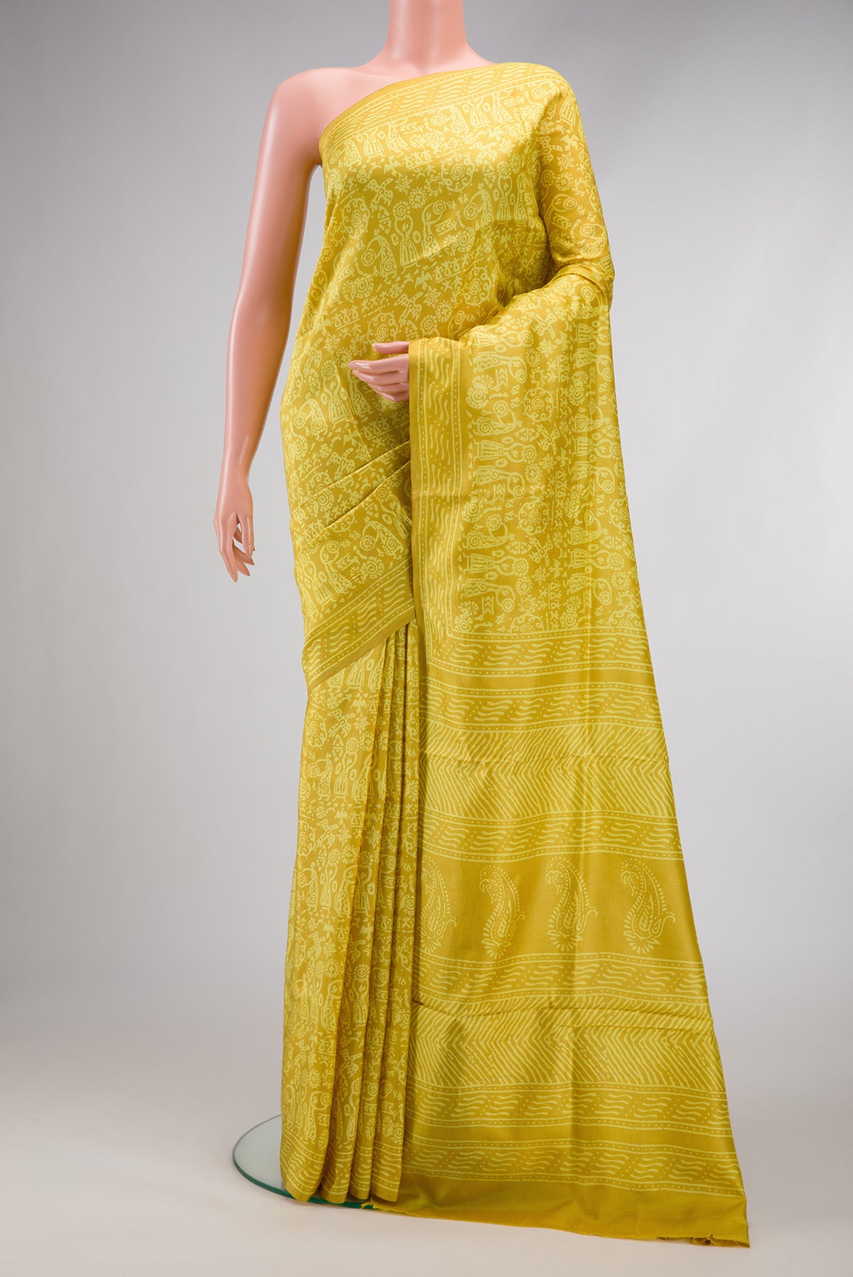 Yellow Printed Silk Saree with Printed design on the body and Printed Border.  displayed on a mannequin