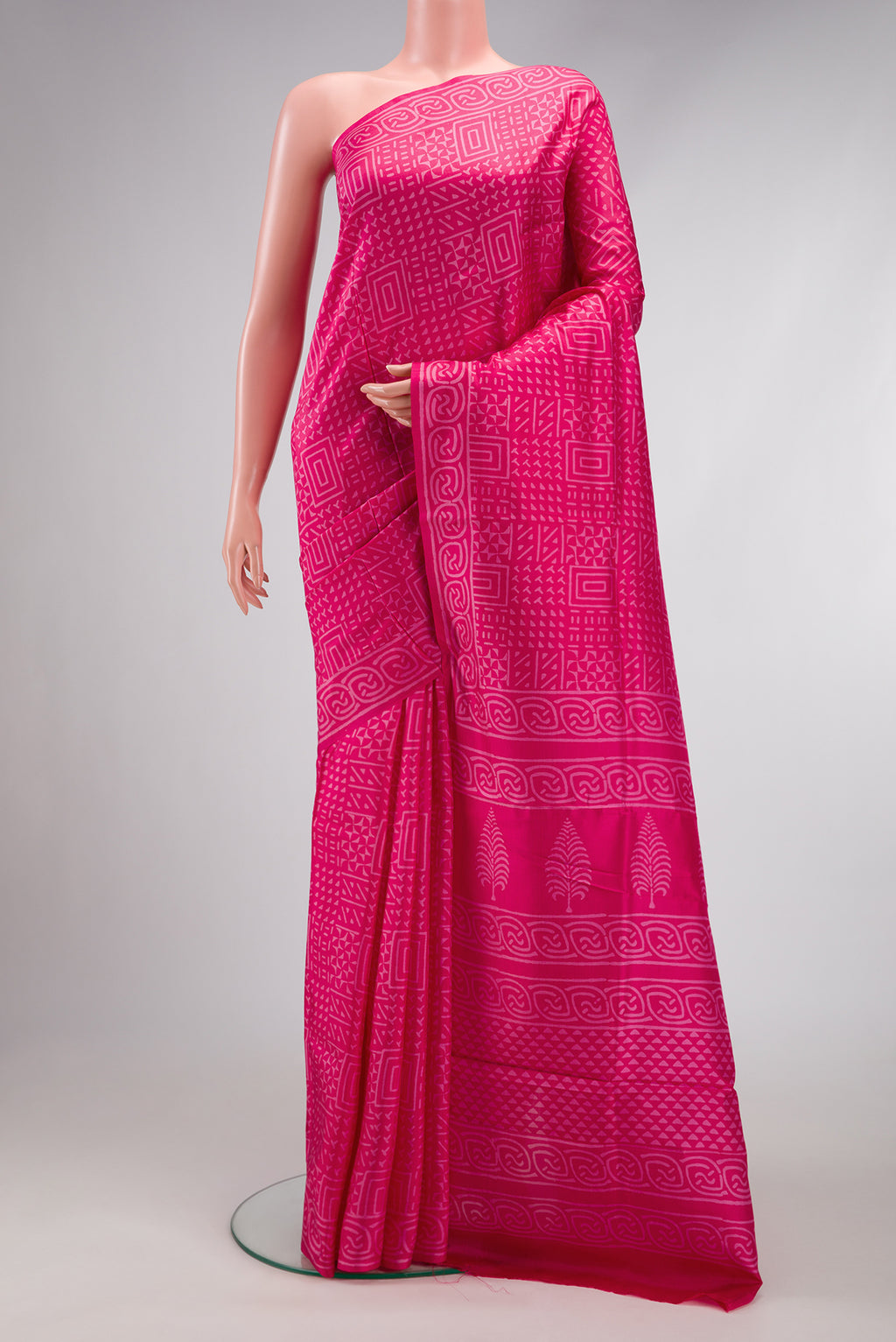 Pink Printed Silk Saree with Printed design on the body and Printed Border.  displayed on a mannequin
