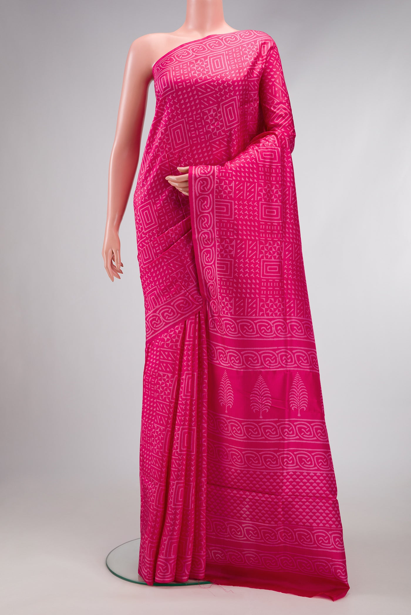 Pink Printed Silk Saree with Printed design on the body and Printed Border.  displayed on a mannequin