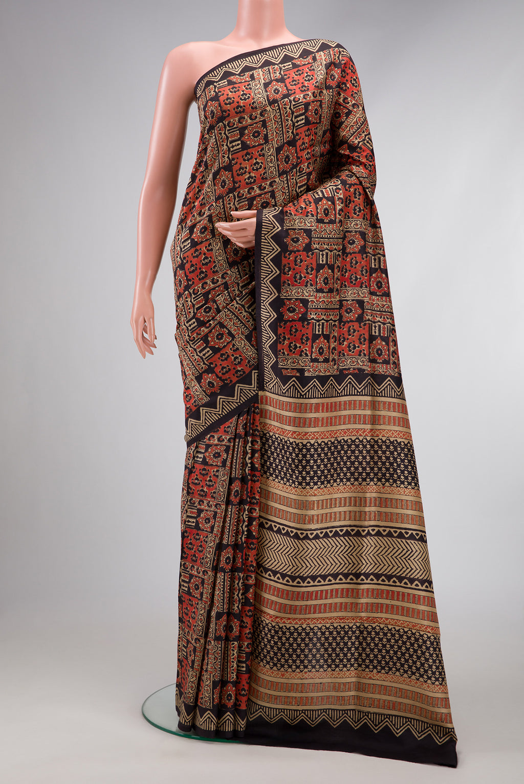 Black Printed Silk Saree with Printed design on the body and Printed Border.  displayed on a mannequin