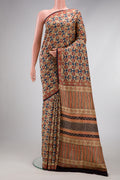 Beige Printed Silk Saree with Printed design on the body and Printed Border.  displayed on a mannequin