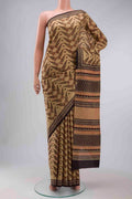 Beige Printed Silk Saree with Printed design on the body and Printed Border displayed on a mannequin