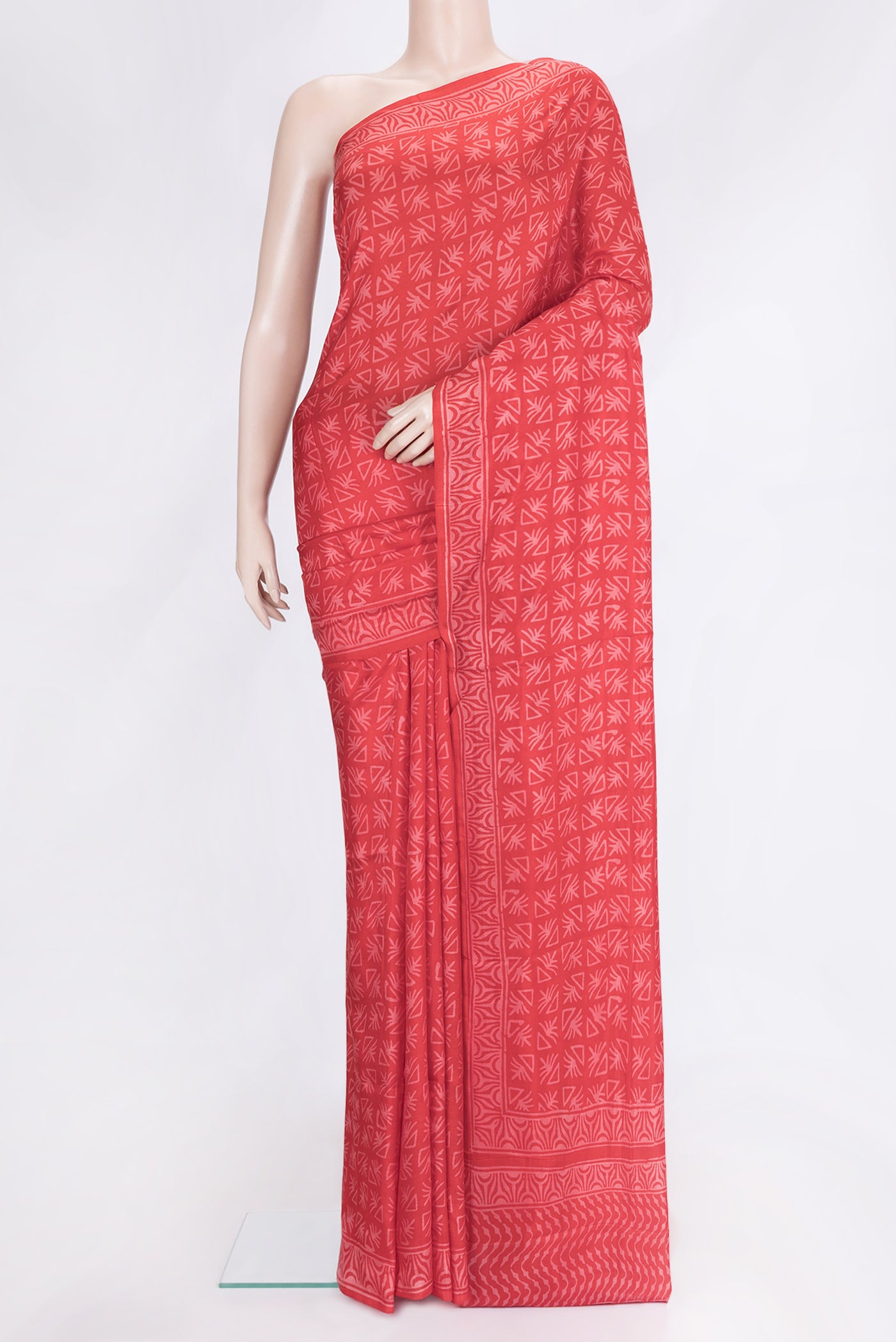 Red Dual Tone Printed Silk Saree with Printed design on the body and Zari Border.  displayed on a mannequin
