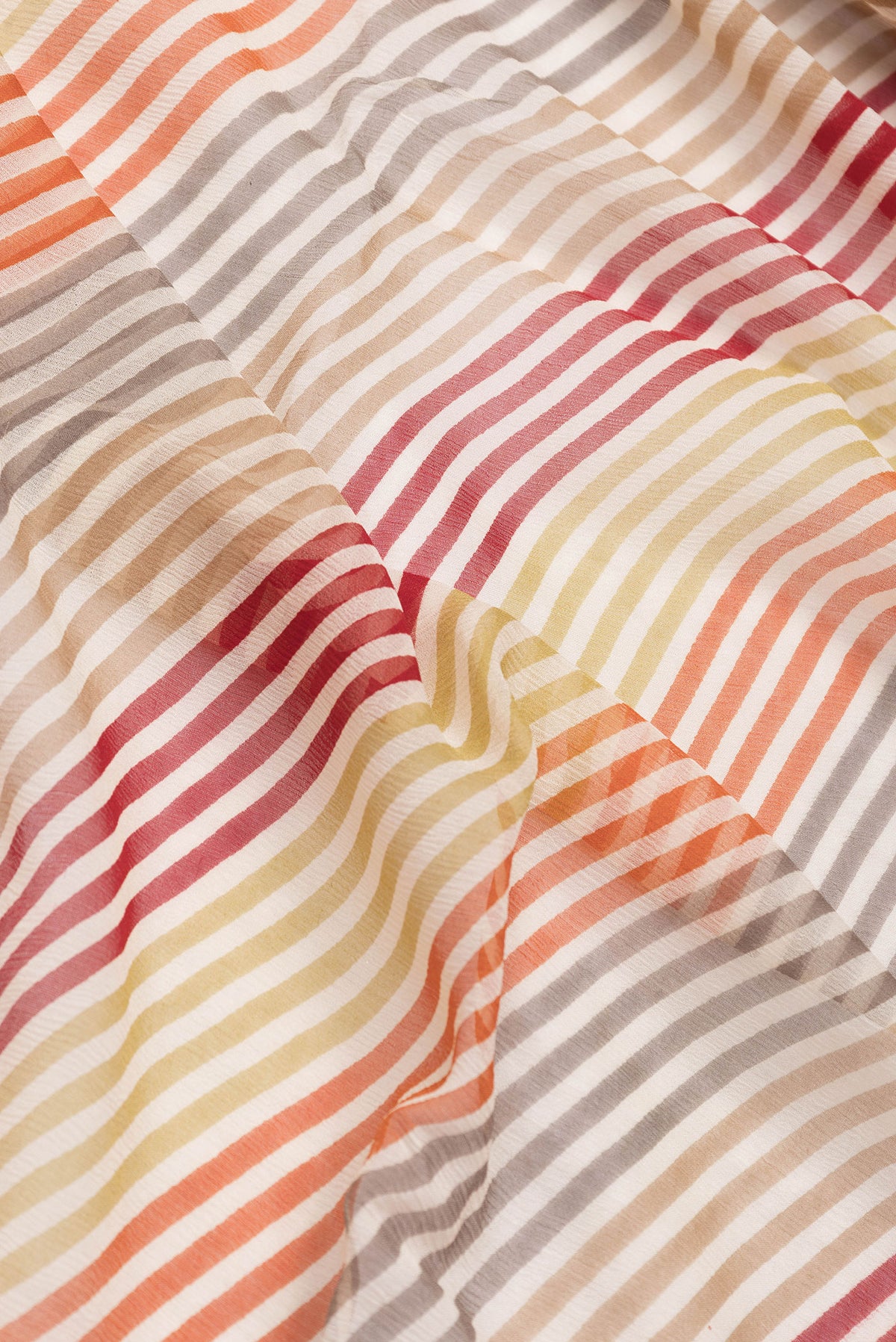 Close up of Sandal Dual Tone Mysore Chiffon Saree with Printed design on the body and Thread Border.  displaying folds