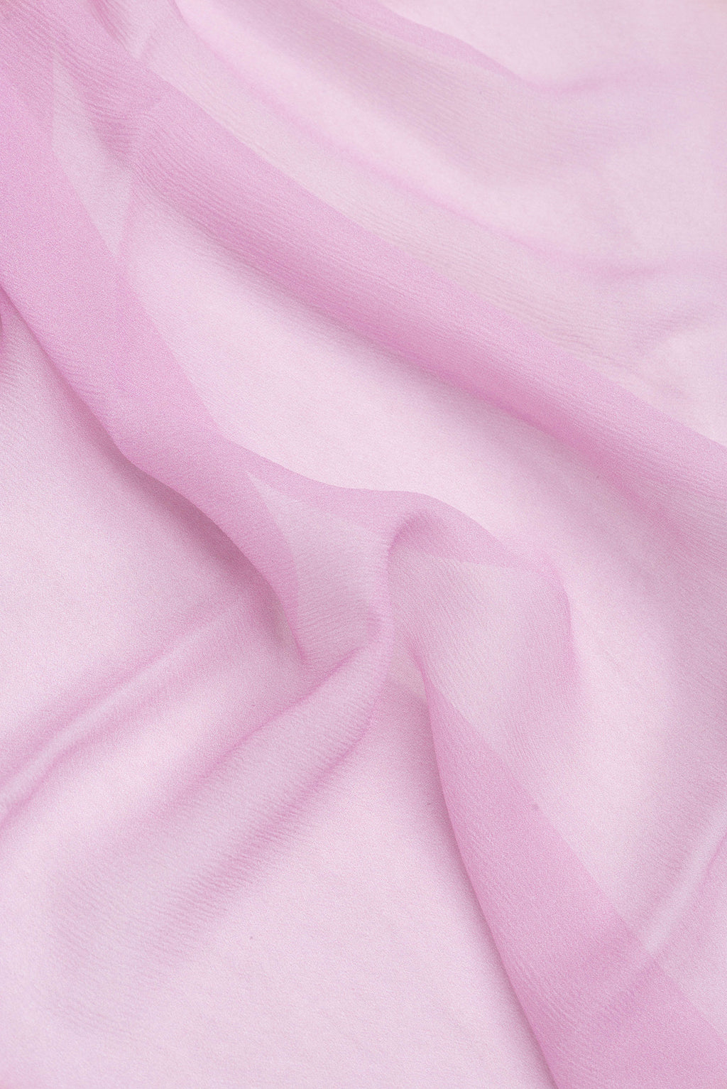 Close up of Pink Dual Tone Mysore Chiffon Saree with Printed design on the body and Printed Border.  displaying folds